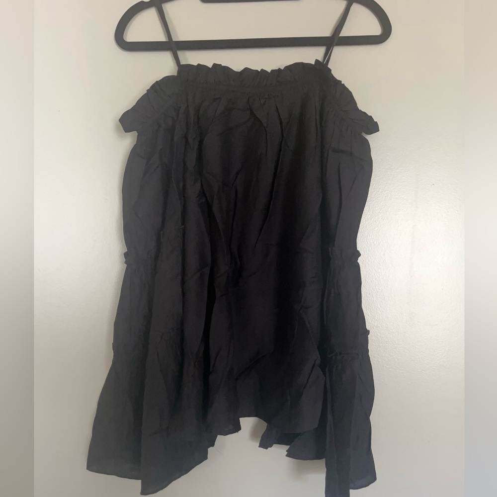 Off the shoulder black ruffled top. Really cute on. Stevie Nicks vibe